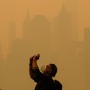 People take photos of the sun as smoke from the wildfires in Canada cause hazy conditions in New York City on June 7, 2023. 