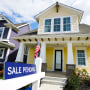 A "sale pending" sign is posted on.a home in Westfield, Ind., Friday, Sept. 25, 2020. Sales of new homes remained steady in October at a seasonally adjusted rate of 999,000 units. While the Commerce Department said October new home sales were down 0.3% from September, the government revised up its September figure marginally.