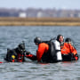 Suffolk County dive team police officers search for possible victims of a suspected serial killer in Hemlock Cove along Ocean Parkway near Cedar Beach, N.Y., April 14, 2011. A Long Island architect has been charged, Friday, July 14, 2023, with murder in the deaths of three of the 11 victims in a long-unsolved string of killings known as the Gilgo Beach murders.