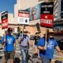 Members and supporters of SAG-AFTRA and WGA walk the picket line at Fox Studios