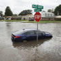 A car is stranded in Virginia Beach intersection after Hurricane Matthew 