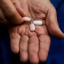 Mary Ann Neilsen holds her last Paxlovid pills while recovering from Covid-19 in Santa Barbara, Calif.