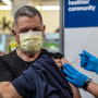 A pharmacist administers a new mRNA Covid vaccine COMIRNATY by Pfizer at CVS Pharmacy in Eagle Rock, Calif., on Sept. 14, 2023.