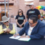 Delegate Seth Damon, right, signs Legislation 0139-23, which aims to repeal Title 9 of the Navajo Nation
Code to recognize same-sex marriages.