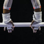Hands on uneven bars during tournament at Indiana Convention Center in Indianapolis, Ind., on May 22, 2021.