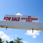 A "for sale" sign on a home in Miami on Feb. 22, 2023.