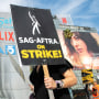 Members of the Screen Actors Guild walk a picket line outside of Netflix in Los Angeles, California, on September 27, 2023. The Writers Guild of America has been on strike since early May and the SAG-AFTRA actors' union joined the writers on the picket lines in July.