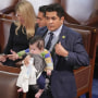 Rep. Jimmy Gomez, D-Calif., carries his infant son Hodge on the chamber floor on Jan. 5, 2023.