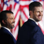 Donald Trump Jr., left, and Eric Trump look on as President Donald Trump prepares to deliver his acceptance speech for the Republican presidential nomination on the South Lawn of the White House on Aug. 27, 2020.