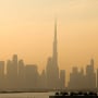Haze obscures the Dubai skyline including Burj Khalifa, the world's tallest building on Dec. 4, 2023. The United Arab Emirates is choking under "alarmingly high" air pollution levels fed by its fossil fuel industry, Human Rights Watch warned on December 4, as the oil-rich country hosts the UN's COP28 climate talks in Dubai. 