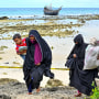More than 100 Rohingya refugees, including women and children, landed in Indonesia's westernmost province on December 2, officials said, but locals threatened to push them back to sea. 