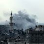 Smoke rises above buildings in Rafah.
