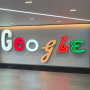 Google's neon signage inside NYC office.
