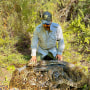Conservancy wildlife biologist, Ian Bartoszek, with a large mating ball of pythons captured in southwest Florida.