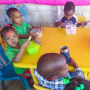Children eat at a table at an orphanage in Haiti