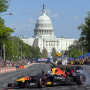 David Coulthard waves to the crowd as he drives the Red Bull RB7 racing car.