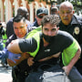 USC public safety officers detain a demonstrator during clashes after officers attempted to take down an encampment in support of Gaza at the University of Southern California on April 24, 2024 in Los Angeles,.