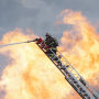 A San Francisco firefighter on a ladder 