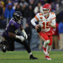 Patrick Mahomes runs with the football during a game between the Kansas City Chiefs and  Baltimore Ravens