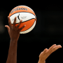 A detail of the WNBA logo is seen on the basketball during an opening tipoff 