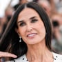 Demi Moore poses for photographers on the red carpet