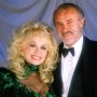 Dolly Parton and Dabney Coleman smile next to one another