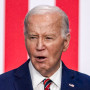 Joe Biden addresses attendees at a podium in front of an american flag