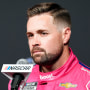 Ricky Stenhouse Jr. in front of a microphone during a conference