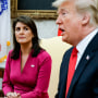 Nikki Haley looks at Donald Trump as he speaks while seated beside her