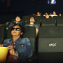 Audience members sit inside a 4DX theater at the Regal Cinemas L.A. LIVE Stadium 14 movie theater in Los Angeles.