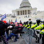 Protesters try to break through a police barrier at the Capitol on Jan. 6, 2021.