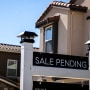 A "Sale Pending" sign outside a house.