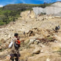 This handout photo taken on May 28, 2024 and released on May 29, 2024 by World Vision shows locals digging at the site of a landslide at Yambali village in the region of Maip Mulitaka, in Papua New Guinea's Enga Province. 
