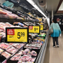 A woman browses the meat aisle at a supermarket in Montebello, Calif., on May 15, 2024. 