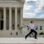 Interns running in front of the Supreme Court