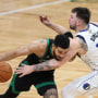 Jayson Tatum #0 of the Boston Celtics drives to the basket against Luka Doncic #77 of the Dallas Mavericks during the second quarter in Game Two of the 2024 NBA Finals at TD Garden on Sunday in Boston, Massachusetts. 