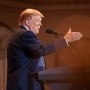 Donald Trump gestures while he speaks 