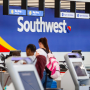 Travelers check in at a Southwest counter.