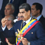 Nicolas Maduro raises his fist