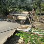 Image: rain storm aftermath bridge washed out