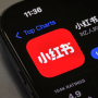 A smartphone screen shows the update page for the RedNote app on the app store