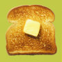 Olive Oil and a piece of toast with a pad of butter