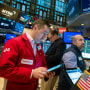 Traders work on the floor of the NYSE