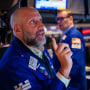 Traders work on the floor of the New York Stock Exchange on May 19, 2025.