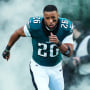 Saquon Barkley runs out of the tunnel prior to an NFL football wild card playoff game