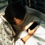 Portrait of a person with mobile phone in hand