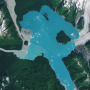 A landmass that was once encased in the ice of the Alsek Glacier is now surrounded by water.