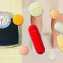 Photo illustration of scales and a variety of pills 