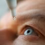Man drops eye drops install lenses, moisturizing