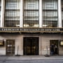 A brick building with tall windows and an awning with lettering: CHURCH OF SCIENTOLOGY OF NEW YORK.